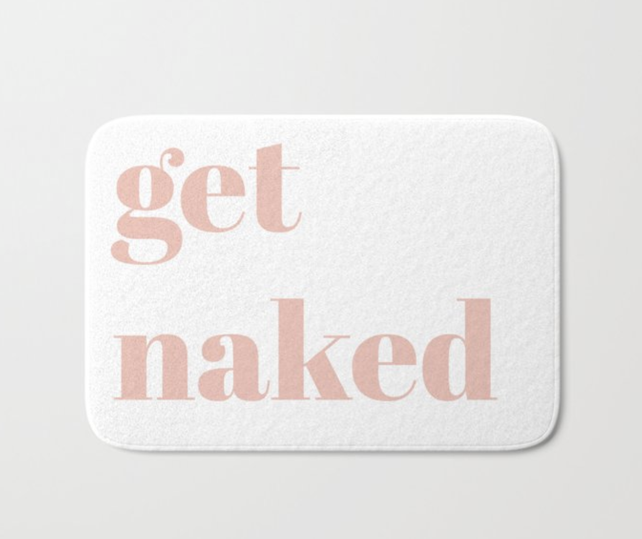 A white rectangular bath mat with the words &quot;get naked&quot; printed on it