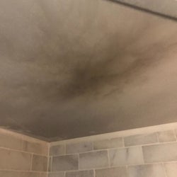 The same reviewer's ceiling showing smoke damage from the toaster oven