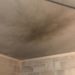 The same reviewer's ceiling showing smoke damage from the toaster oven