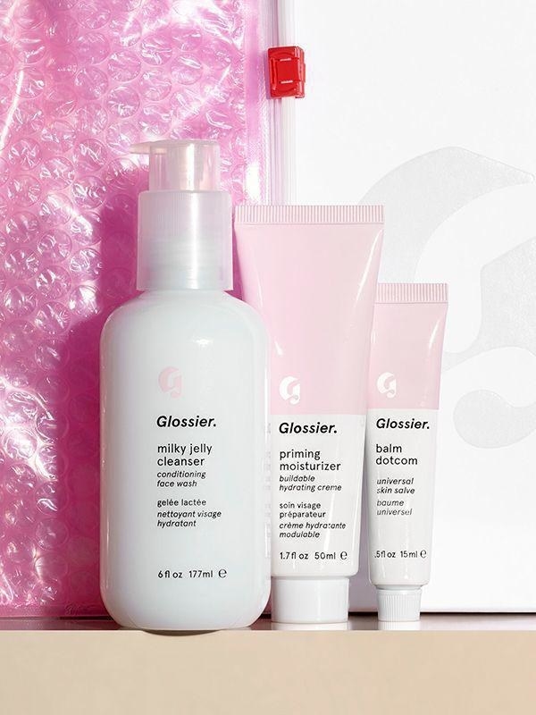 a bottle of milky jelly cleanser, a squeeze tube of priming moisturizer, and a smaller squeeze tube of skin salve