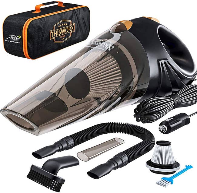 A car vacuum kit that includes a handheld vacuum, a retention bag, and assorted attachments, plugs, and filters