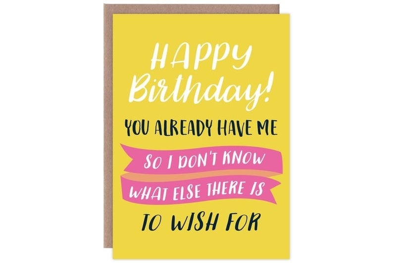 A yellow, white, black, and pink card that reads &quot;Happy birthday! You already have me so I don&#x27;t know what else there is to wish for&quot;