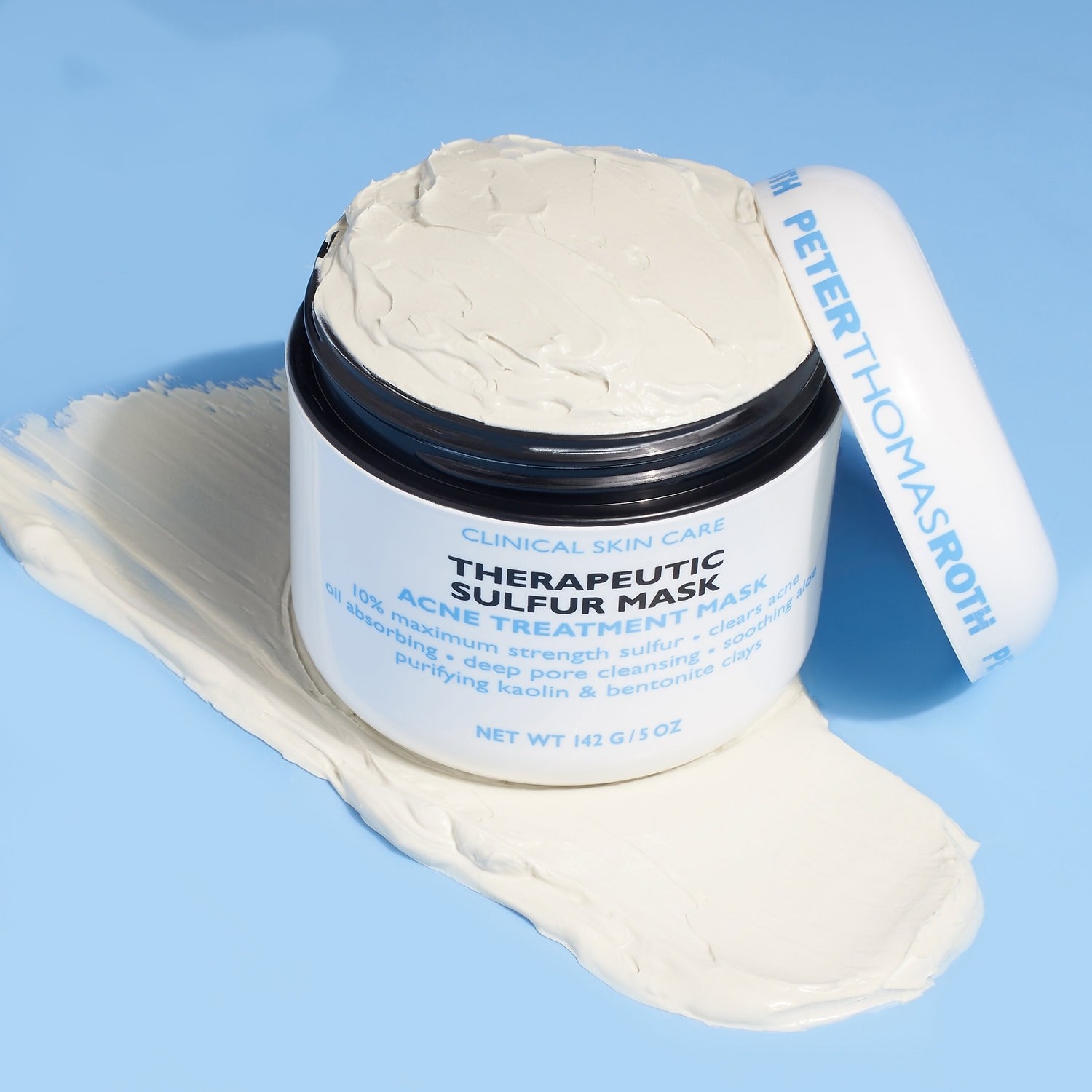 white jar labeled &quot;therapeutic sulfur mask&quot; with white product inside 