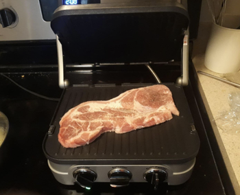 reviewer photo of a piece of steak on the griddler