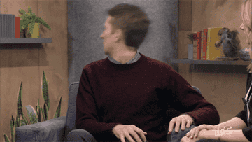gif of Scott Aukerman in the TV show &quot;Comedy Bang Bang&quot; with his head spinning around and around