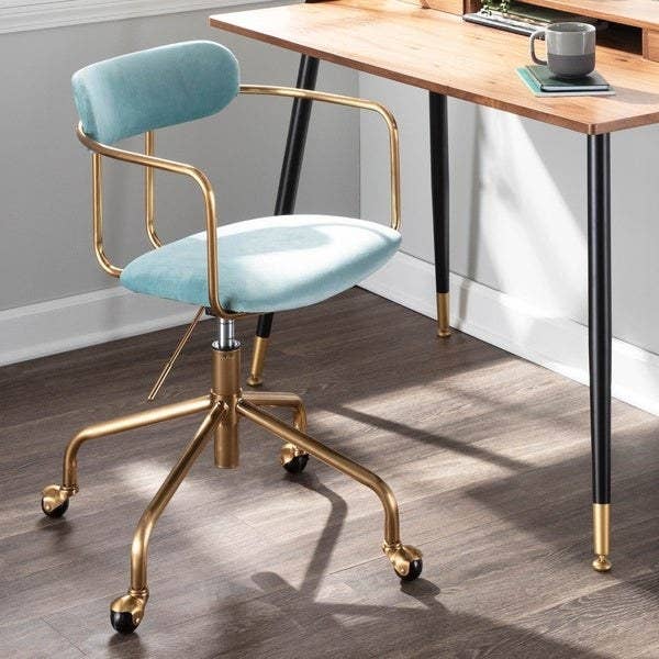 blue velvet and gold metal desk chair with a cushioned seat and back and metal arms