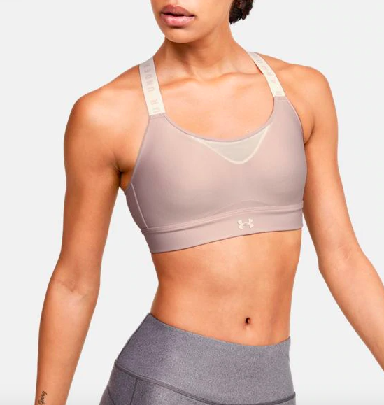 Model wearing the fitted sports bra in dash pink