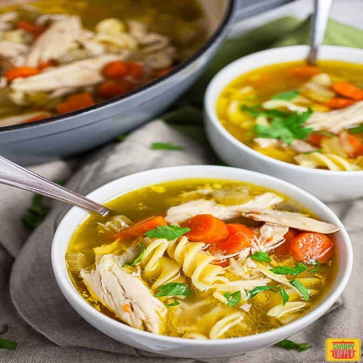 Bowls of piping hot chicken noodle soup.