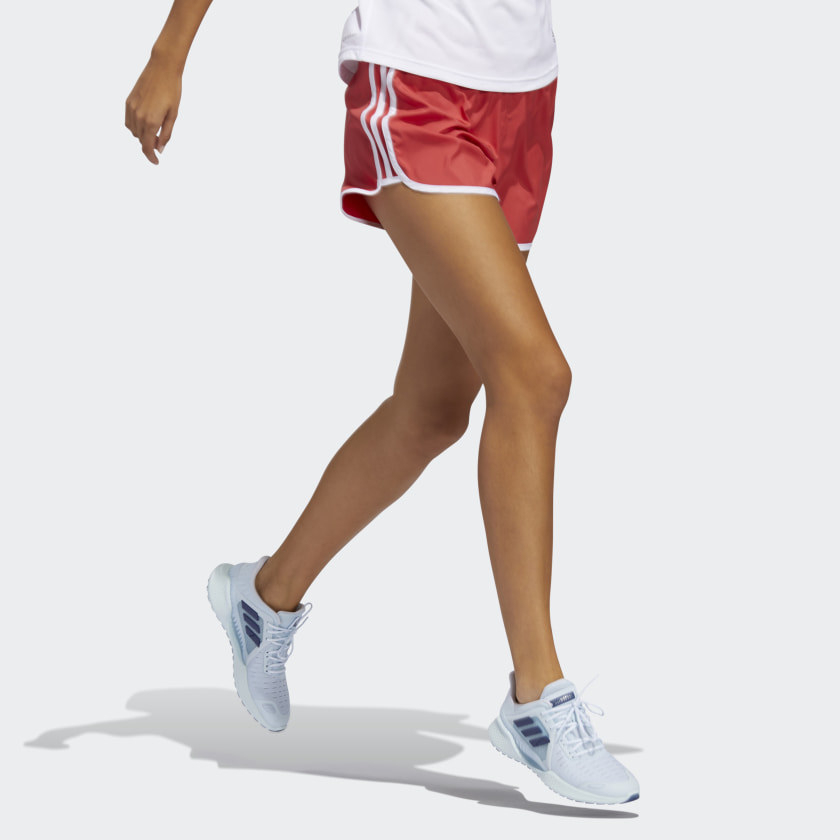 Pink/red running shorts on person in motion 