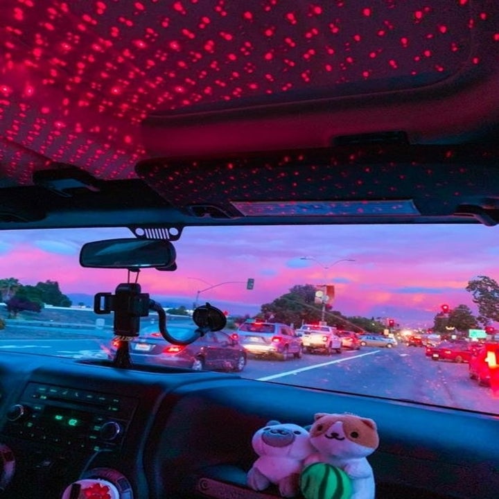 A reviewer's using the star projector in their car