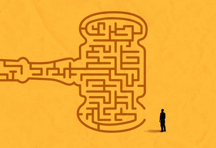 an illustration of man staring at a maze that looks like a judge's gavel