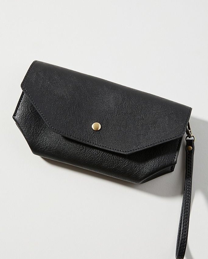A black wallet with wrist strap on a white background 