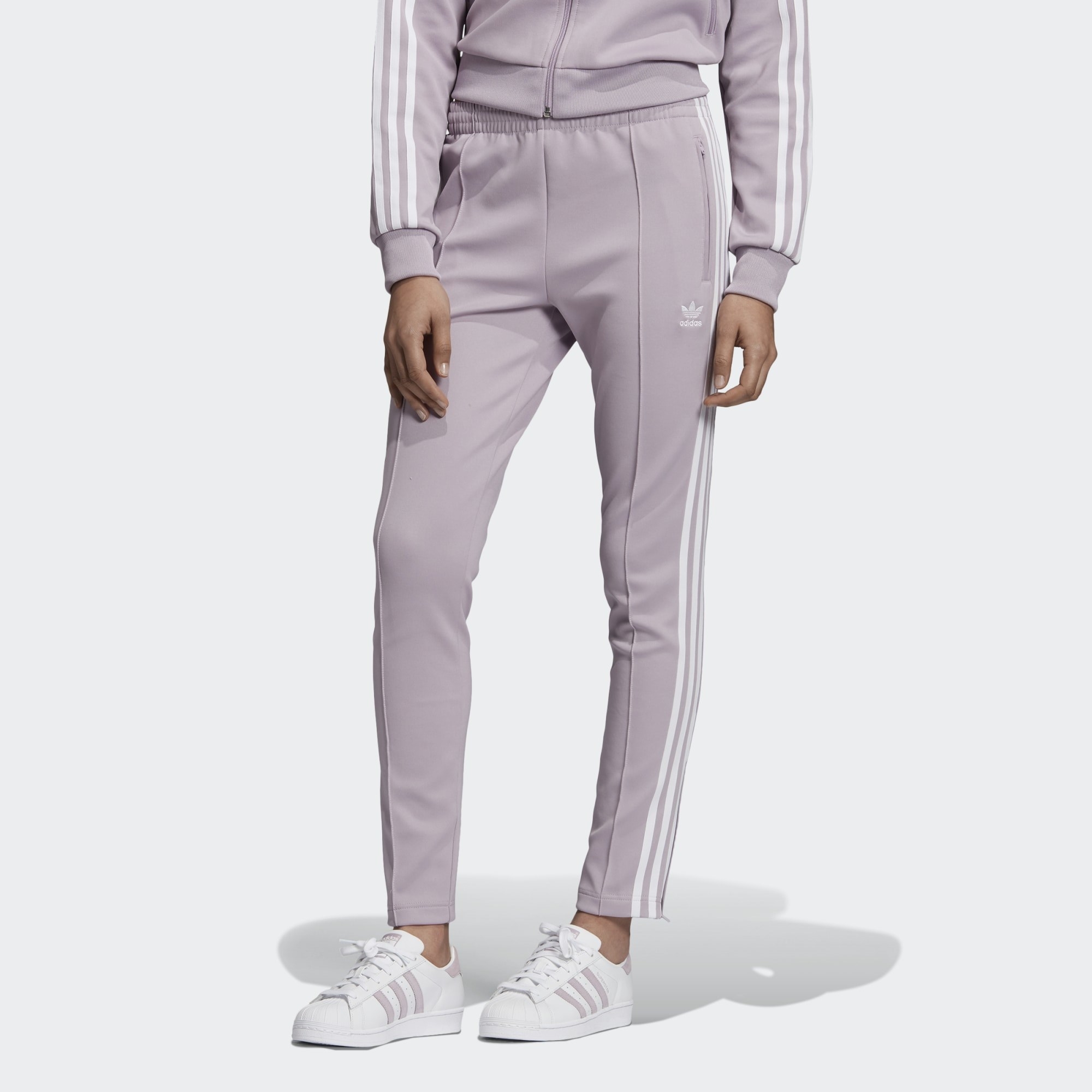Soft violet track pants paired with full matching ensemble 
