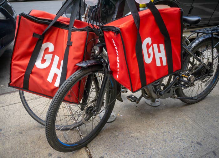 A bicycle with GrubHub delivery bags
