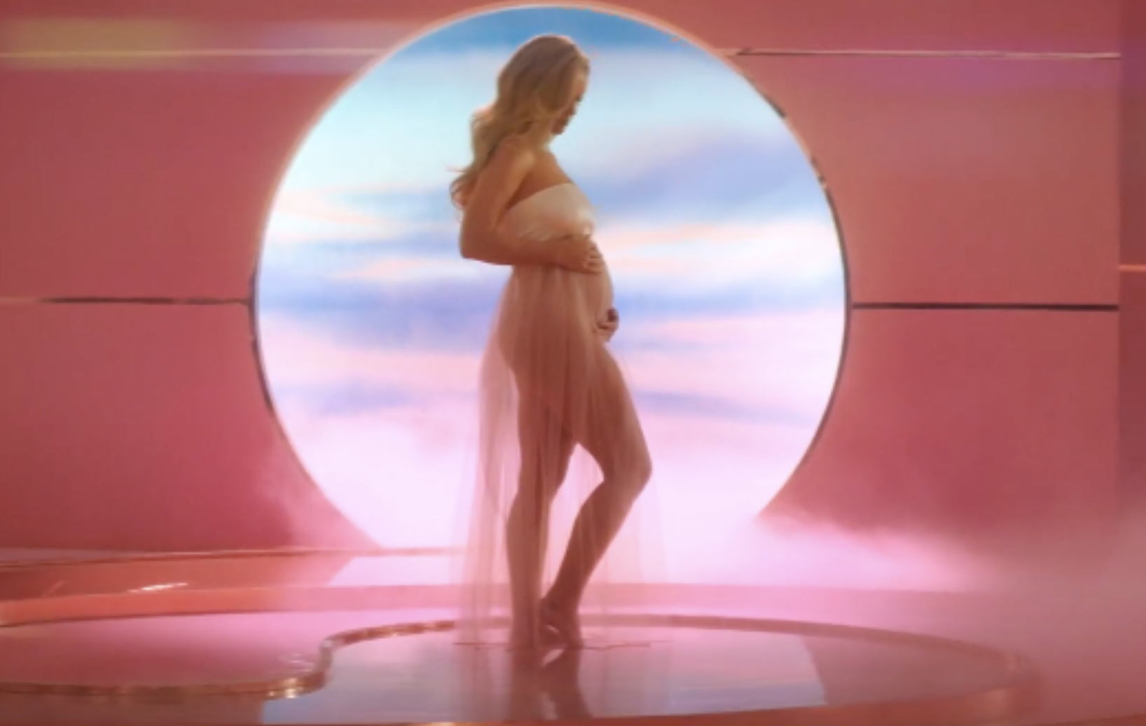 Katy reveals her baby bump for the first time in the video for &quot;Never Worn White&quot;.