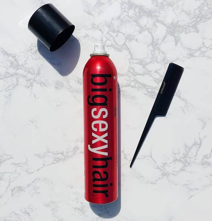 red bottle with black spray nozzle labeled &quot;big sexy hair&quot; 