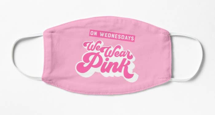 A pink nonmedical face mask that reads &quot;On Wednesdays, we wear pink&quot; in pink and white font