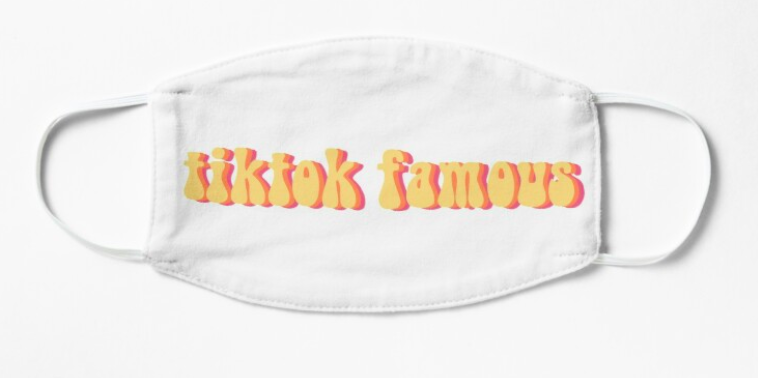A white nonmedical face mask that reads &quot;tiktok famous&quot; in yellow and pink font