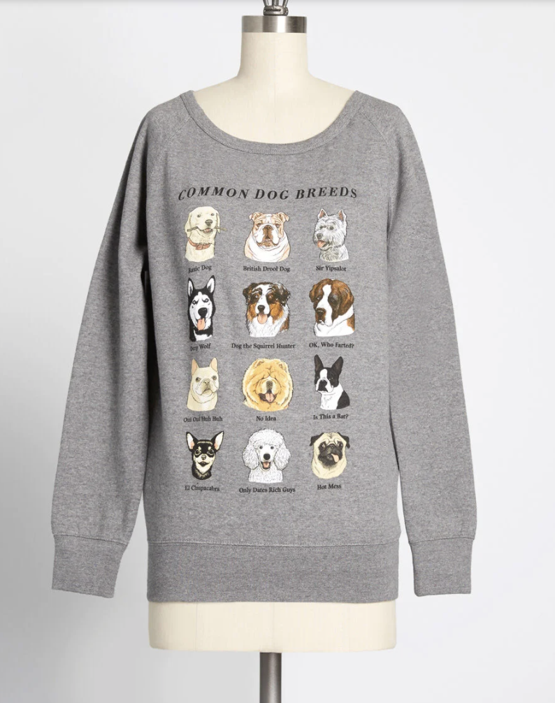 a grey sweatshirt on a mannequin that features 12 different dog breeds and funny sayings underneath each dog