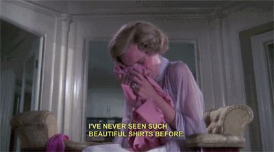 gif of Mia Farrow in the movie "the great gatsby" crying and wiping her tears on a pink shirt with the caption "I've never seen such beautiful shirts before"