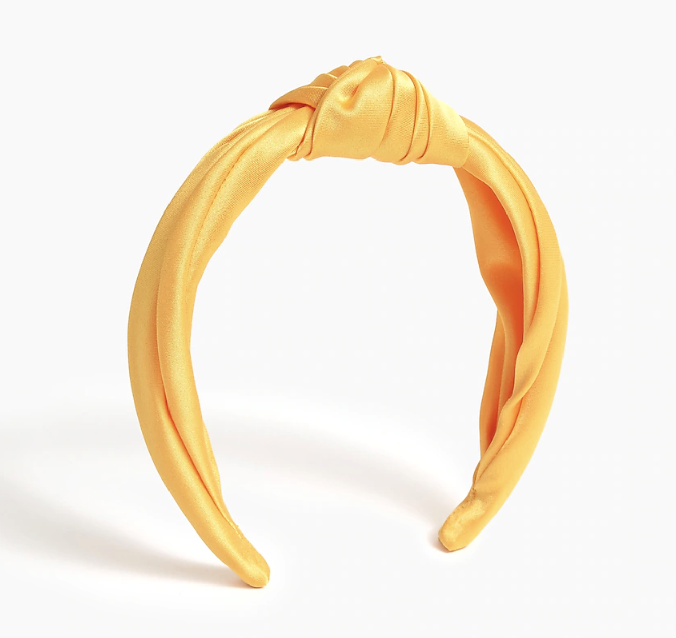 The headband in yellow against a plain background