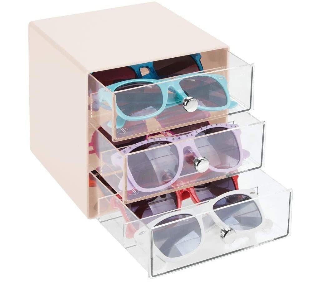product shot of cream color box-like organizer with three clear drawers in front to slide out for storing sunglasses or eyeglasses