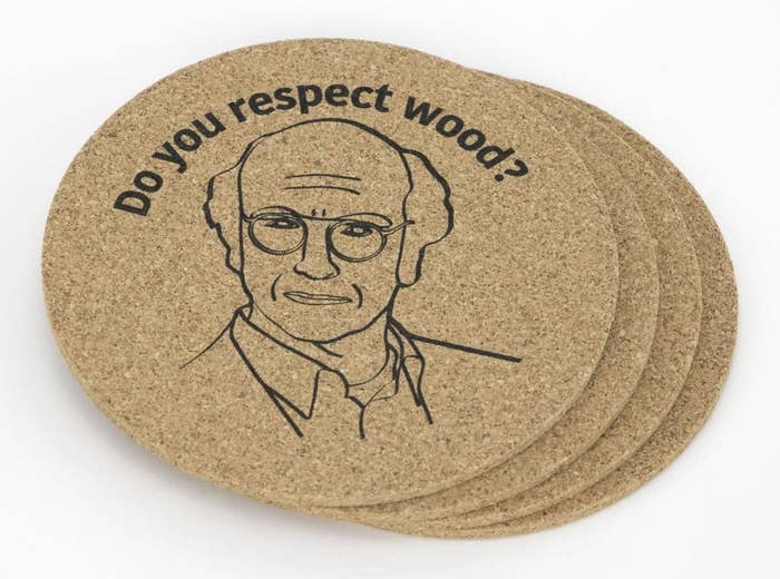 A pile of four cork coasters that say &quot;do you respect wood?&quot; with Larry David glaring at you
