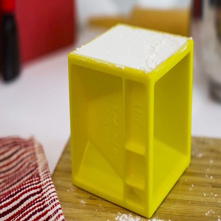 The measuring cube, featuring different-sized measurements on each surface