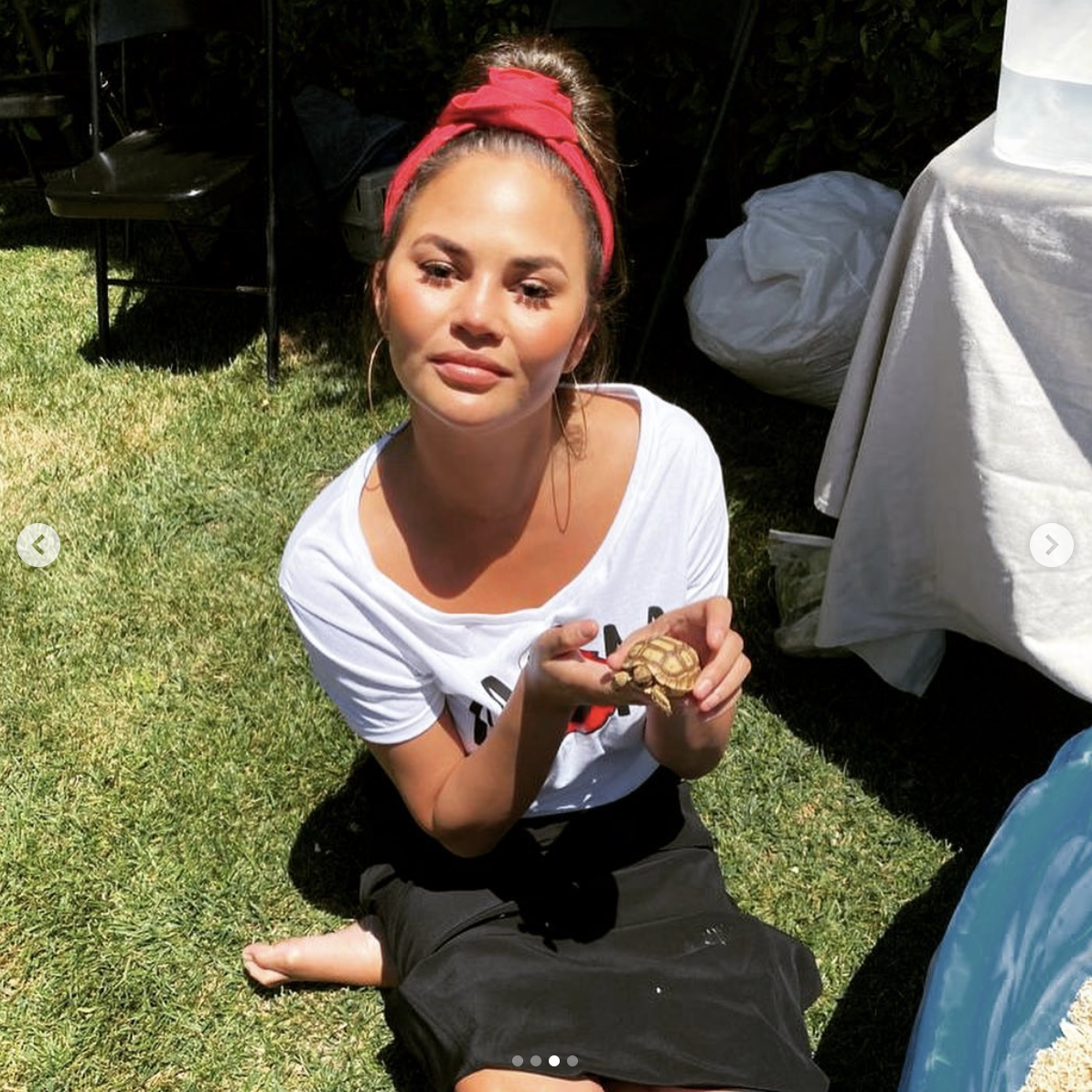 Chrissy holding a reptile at Miles&#x27; birthday party.