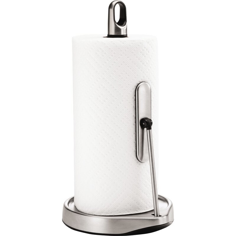 A chrome metal paper towel holder with an arm holding the roll of paper towels vertically 
