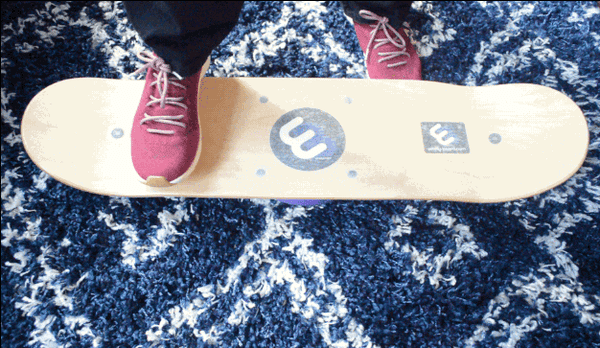 BuzzFeed Writer Whitney Jefferson balances on a whirly board