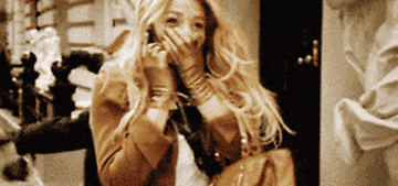 A gif of Blair and Serena from &quot;Gossip Girl&quot; excitedly talking on the phone