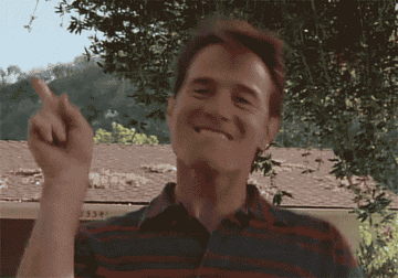 Gif of a man dancing and pointing his fingers 