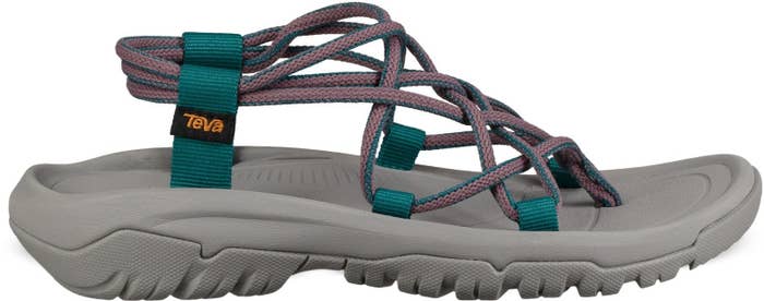 Side view of sandal with pink straps and gray base