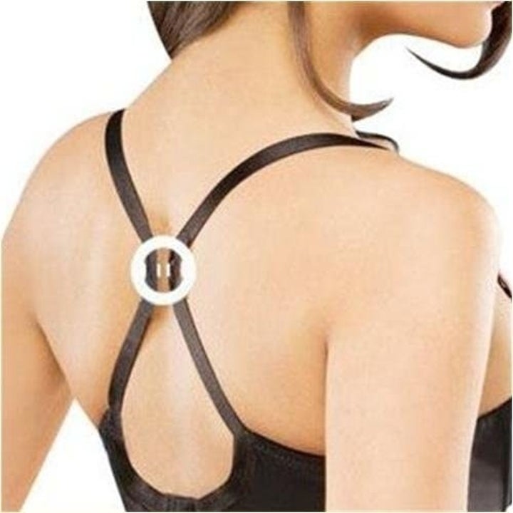 back of a different model wearing a bra clip that joins the two bra straps together to create an X racerback shape