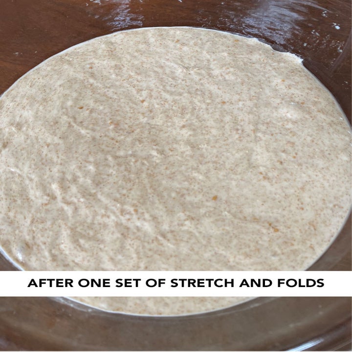 A bowl full of dough with some very small air bubbles in it.