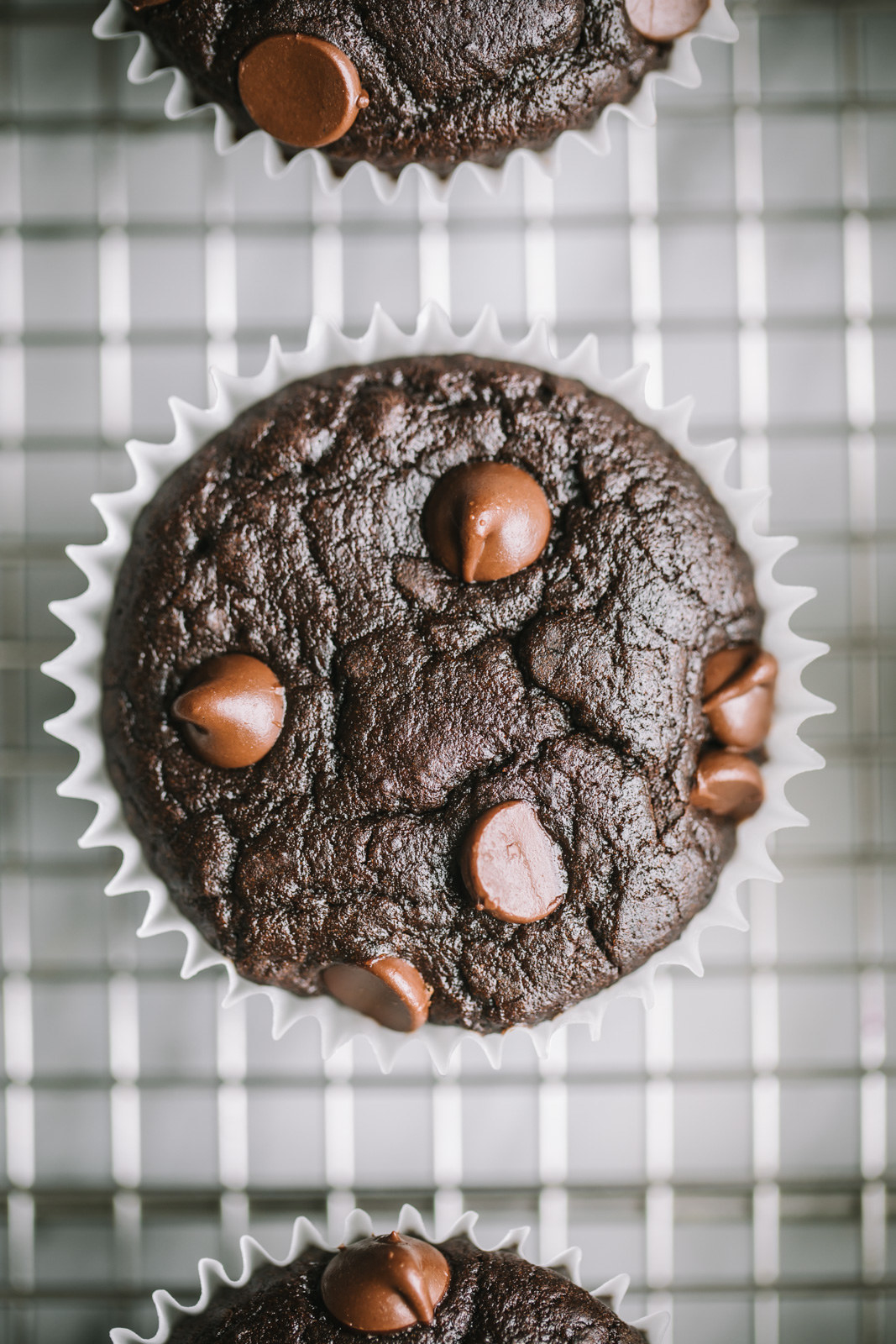 Close-up of Flourless Black Bean Brownie Muffins on a rack
