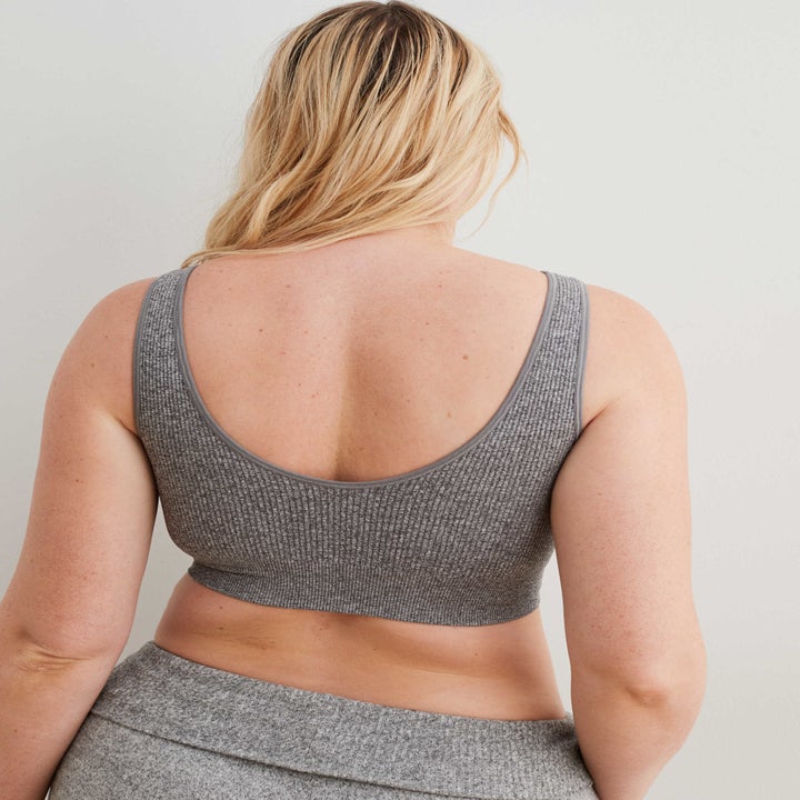 model showing the back of the bralette which has a scoop back and comes down to the waist