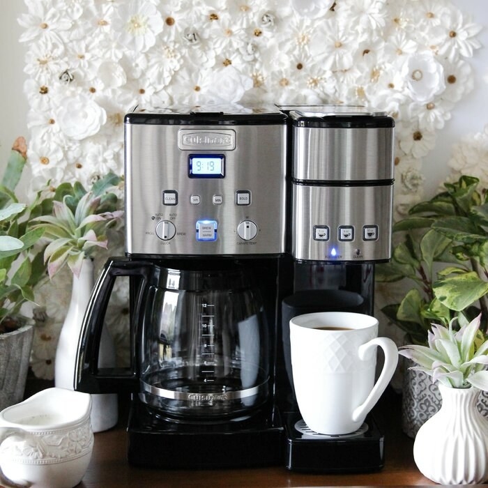 A two-sided coffeemaker showing a carafe on one side and a single-serve maker on the other side