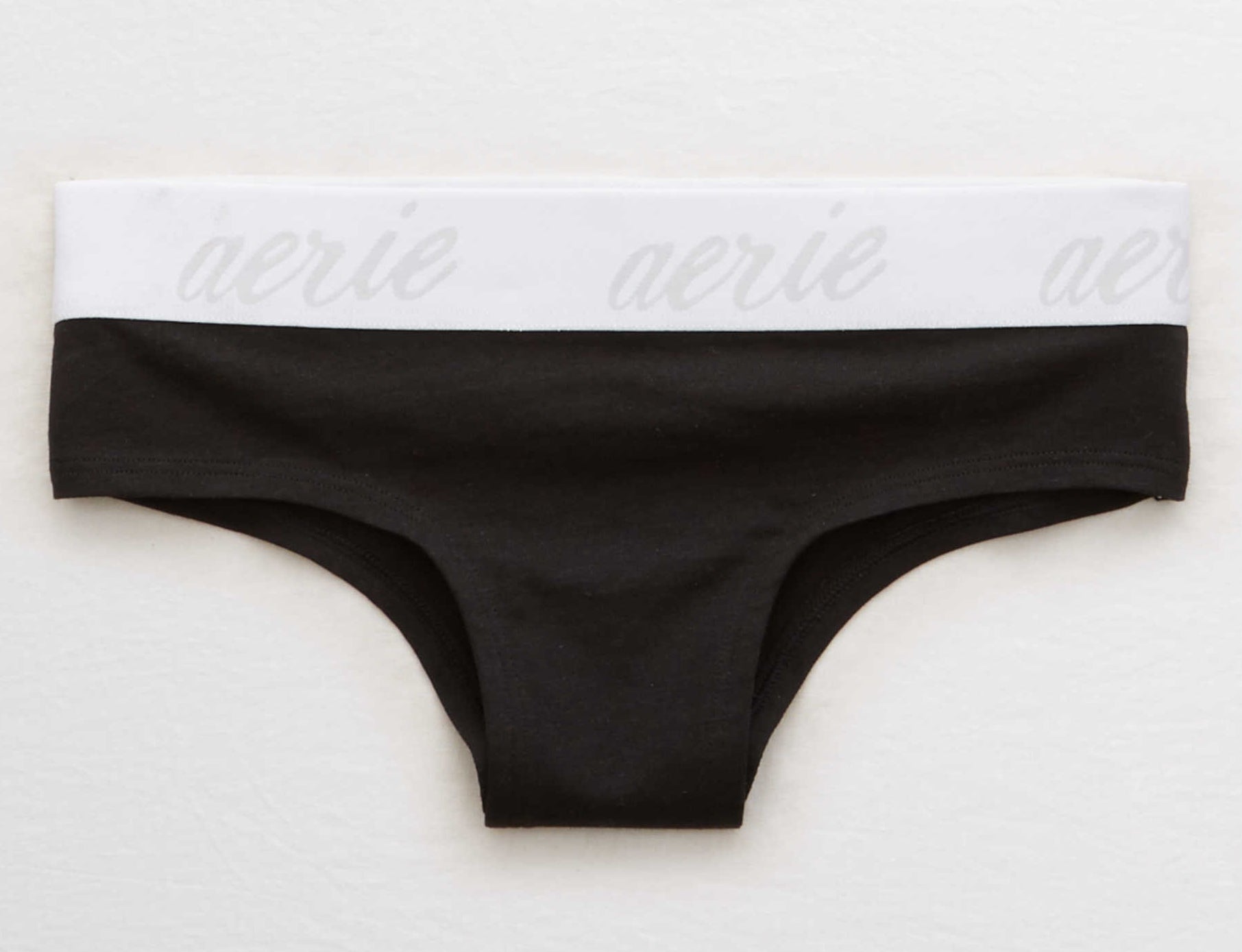 black cheeky undies with a thick white waistband reading &quot;Aerie&quot;
