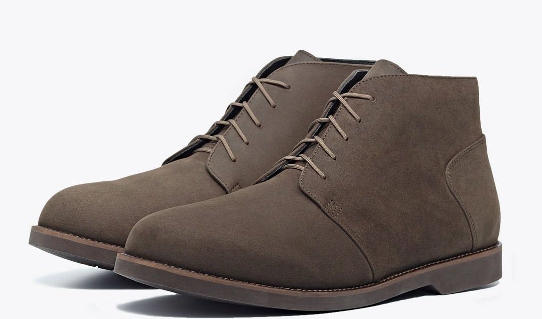 A dusty brown pair of Nisolo chukka boots