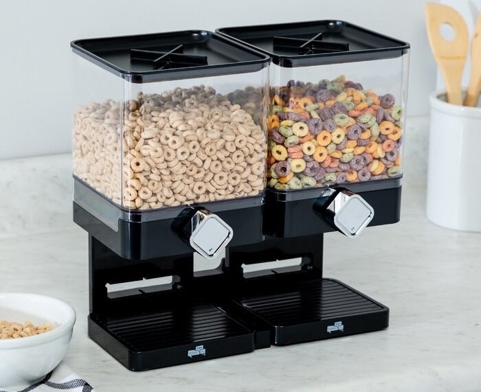 A dual dispenser with each side filled with a different type of cereal