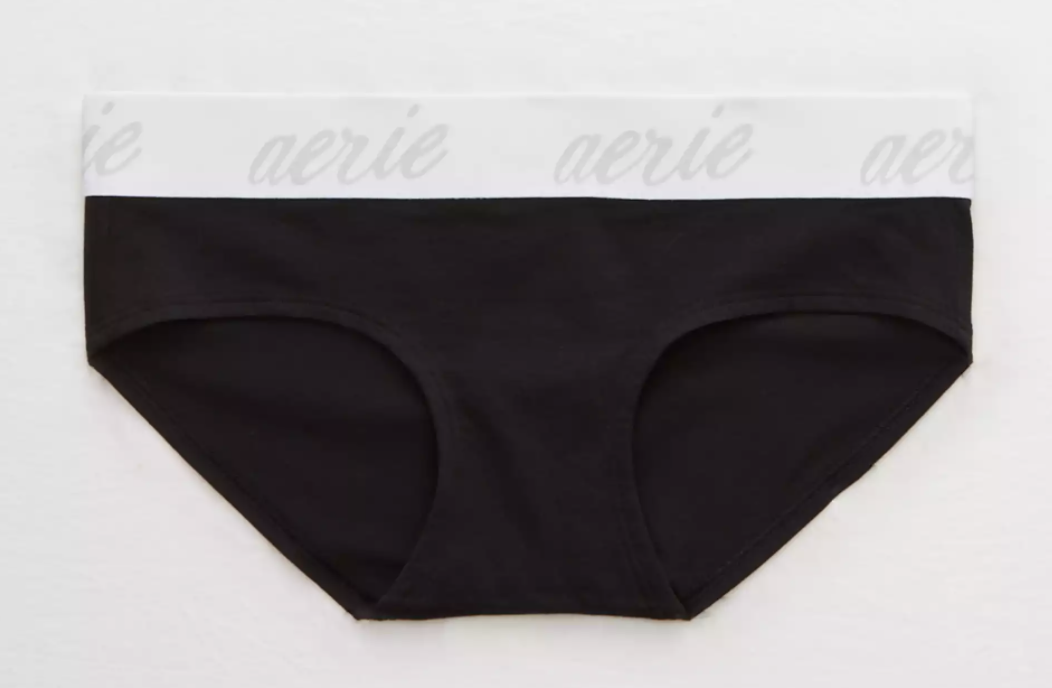 A pair of black cotton underwear with a white band that says &quot;Aerie&quot; against a white background 