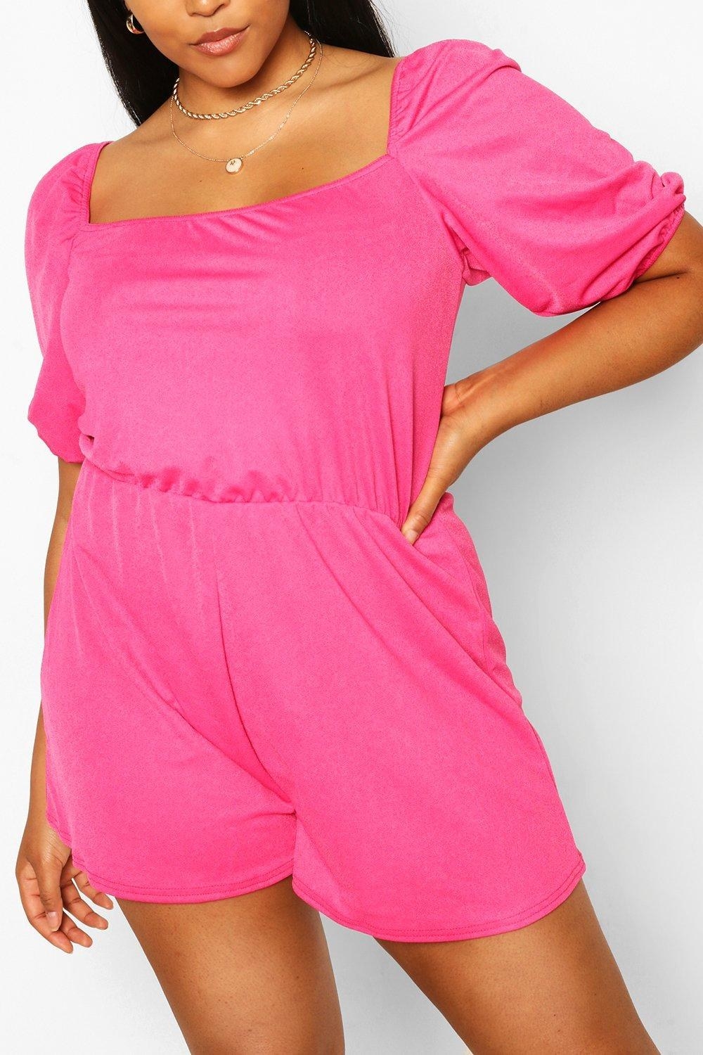A model wearing the romper in bright pink