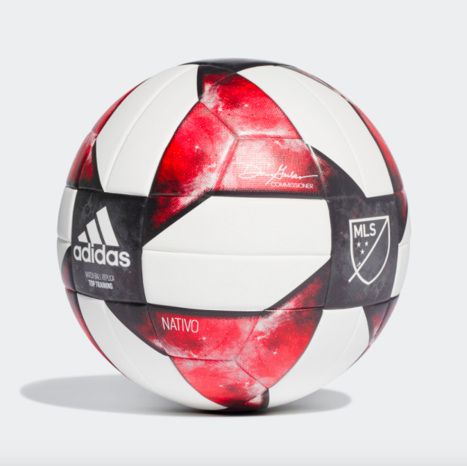 A red, white, and black soccer ball with the MLS and Adidas logo 