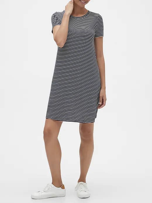 A woman wearing a midi length dress