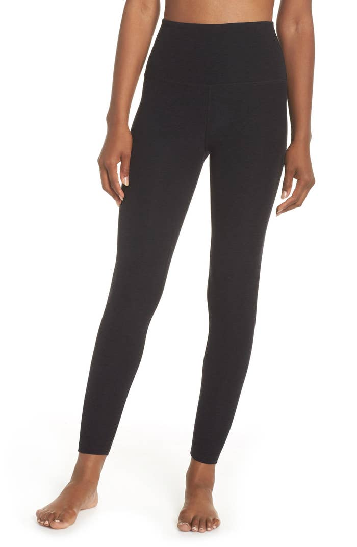 Model wearing black high waist leggings