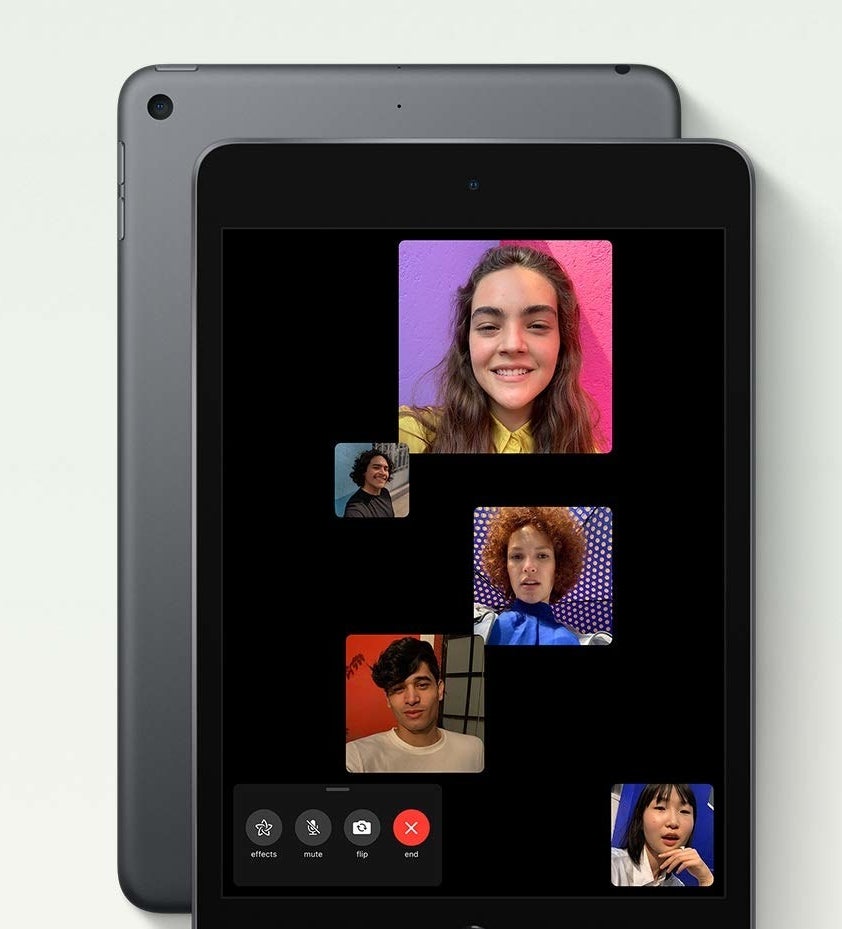 An iPad mini with multiple people FaceTiming