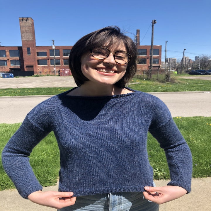 the writer wearing the finished navy blue Haptic Sweater