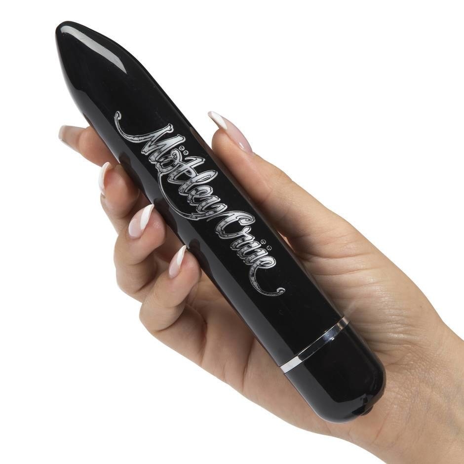 person holding the bullet-style vibrator with &quot;Dr. Feelgood&quot; written on it